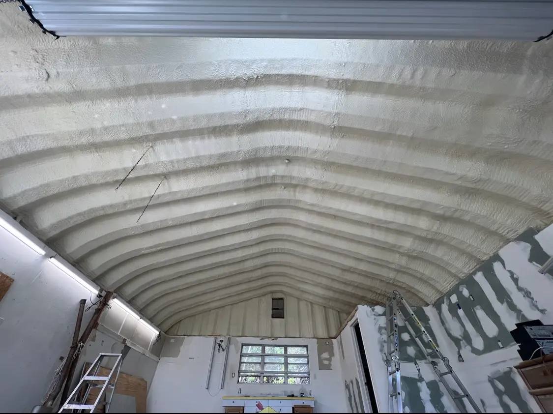 Spray polyurethane foam applied to the underside of a metal roof deck in Paducah